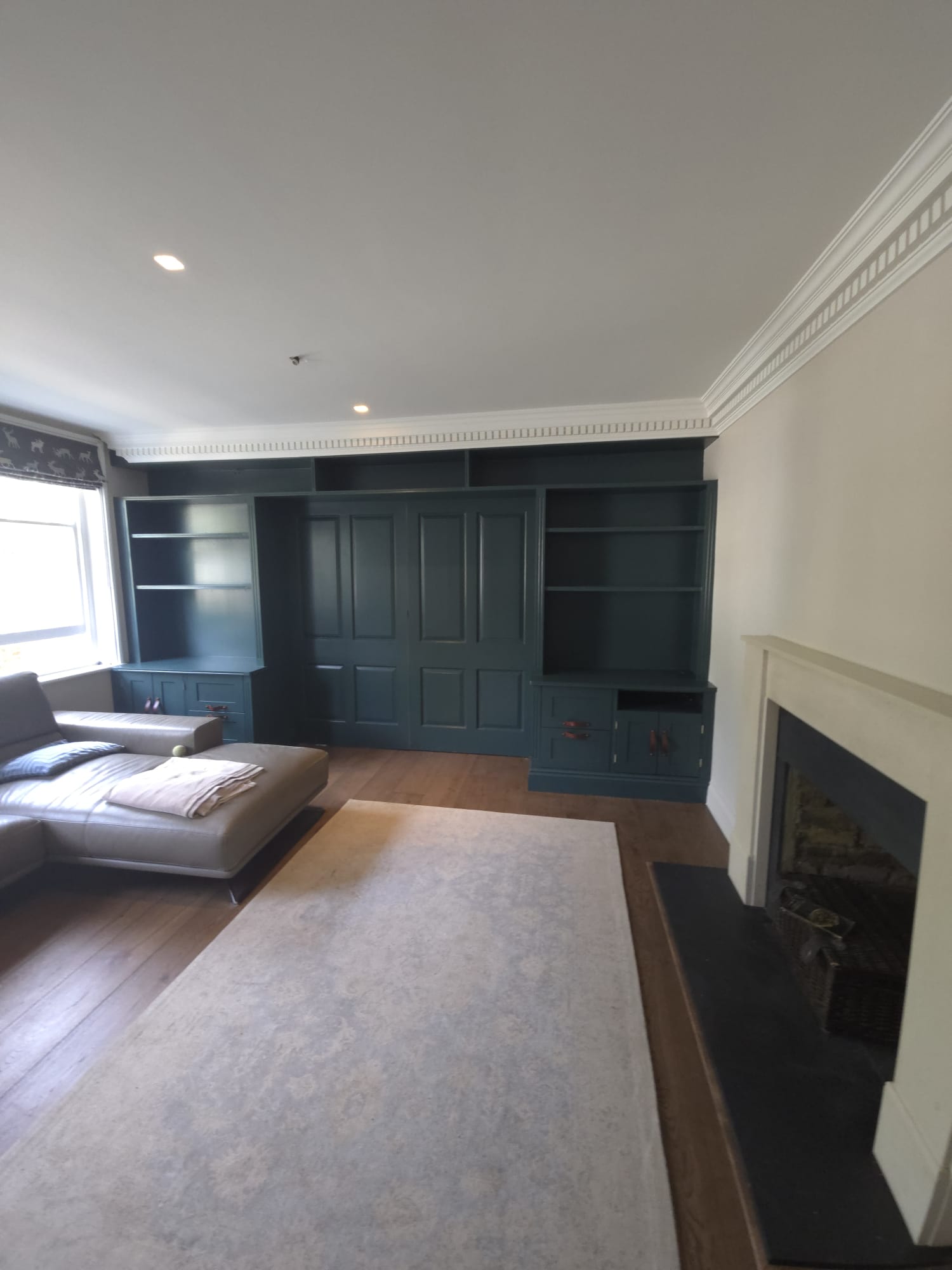 Painted stairwell with crisp white woodwork and neutral walls