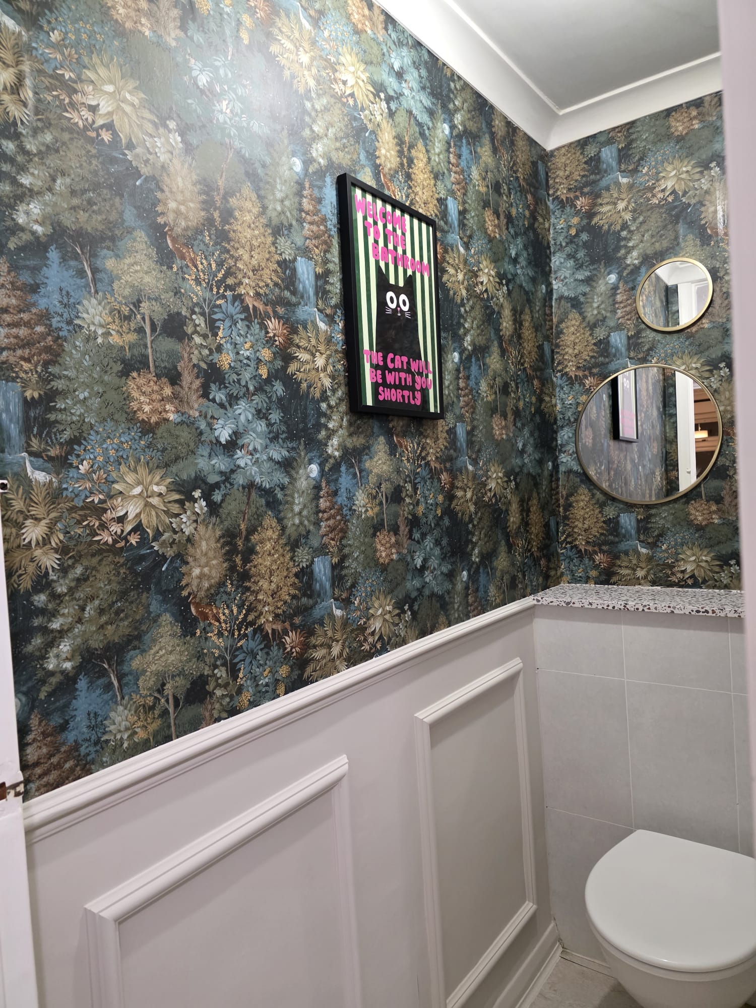 Designer wallpaper above hand painted wainscoting hung by Shreeve and Sons wallpapering specialists