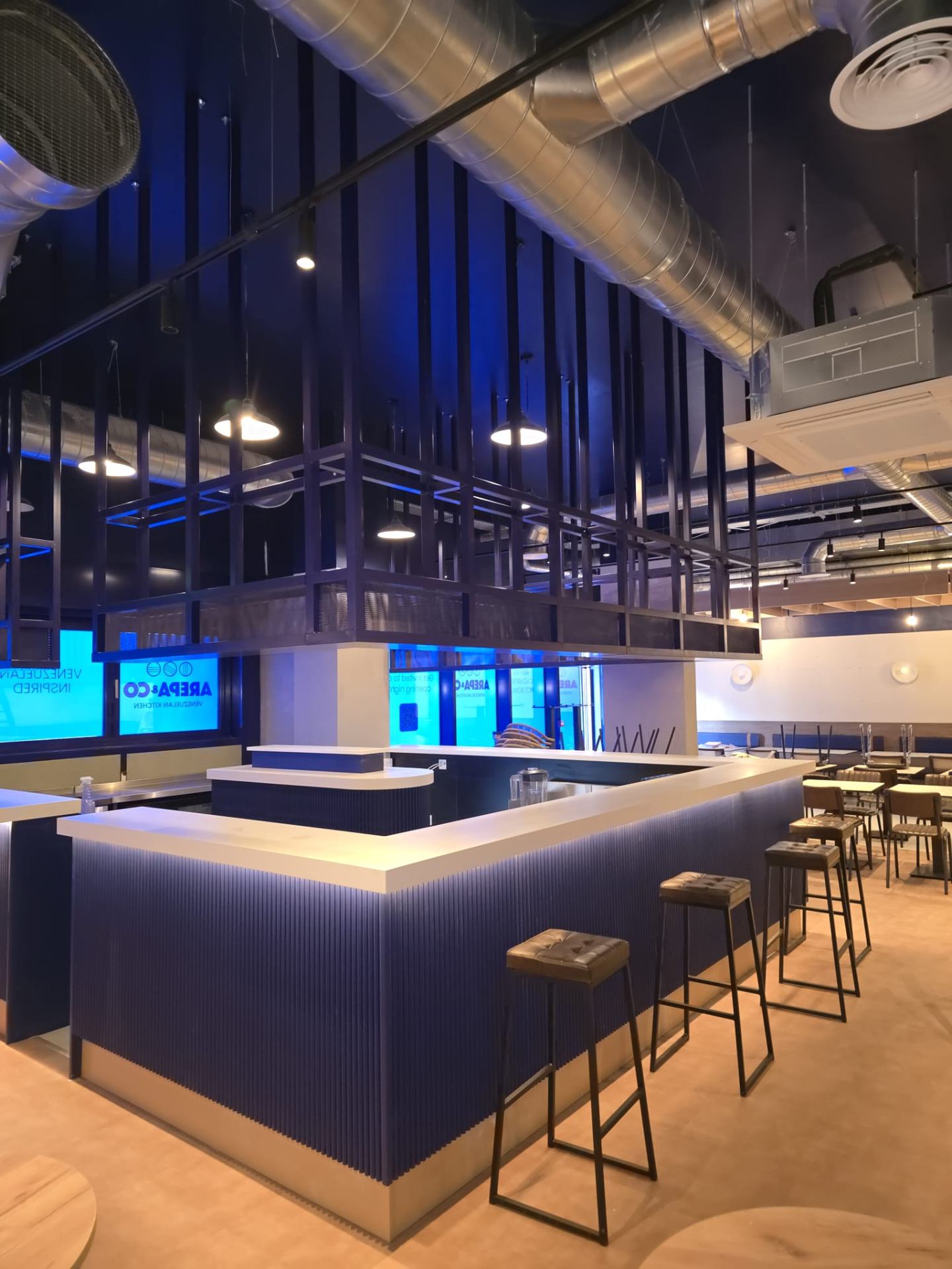 Commercial bar and restaurant interior painted in modern blue tones