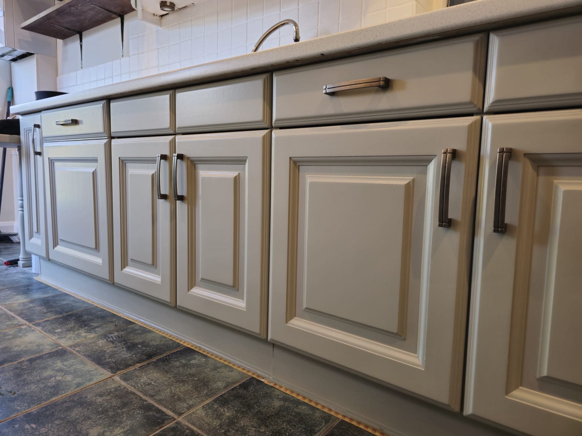 Close-up of spray painted kitchen cabinet with satin finish