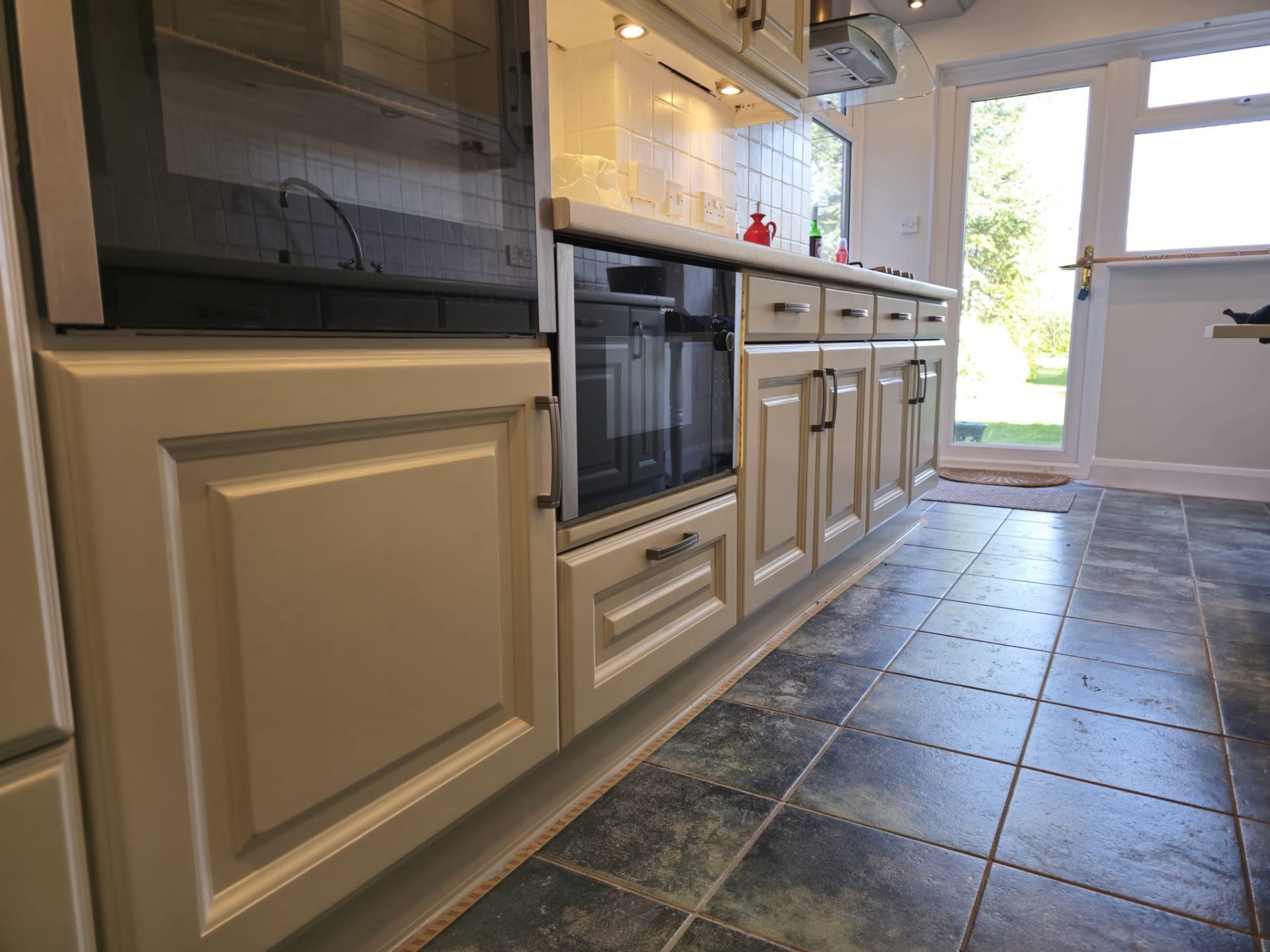 Kitchen cabinets with professional spray paint finish from a low angle