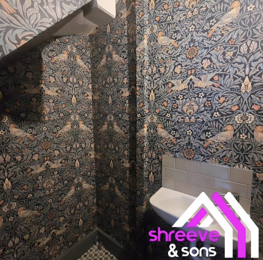Cloakroom hung in William Morris Strawberry Thief style wallpaper by Shreeve and Sons