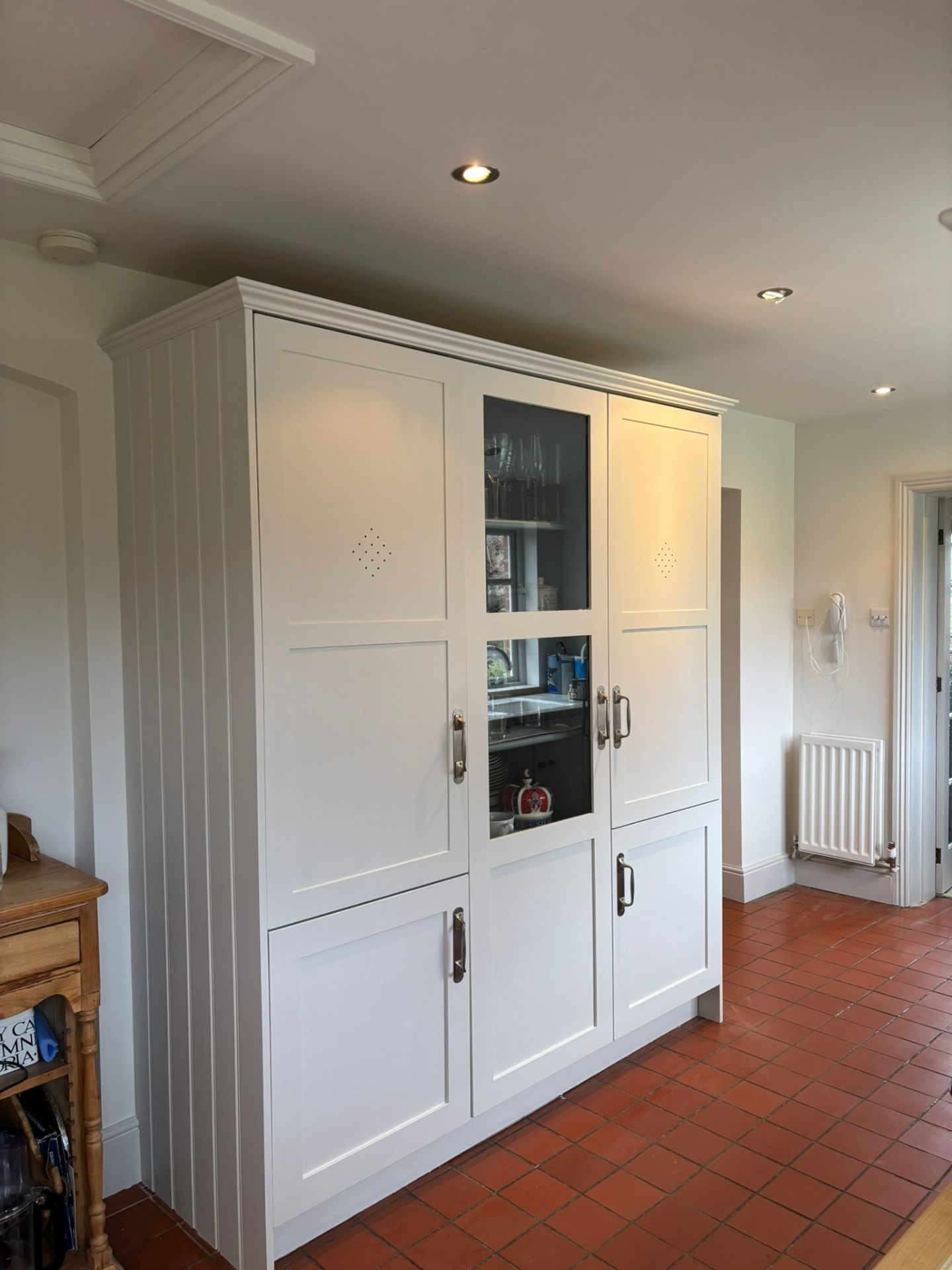 Hand painted white pantry cupboard with glass display panel